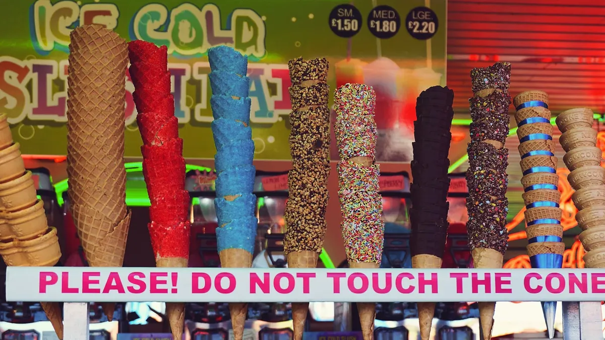 A playful assortment of colorful ice cream cones displayed at a vibrant stall.