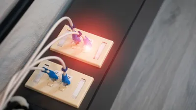 Close-up view of Ethernet ports with cables and illuminated LED indicator. Modern data connection setup.