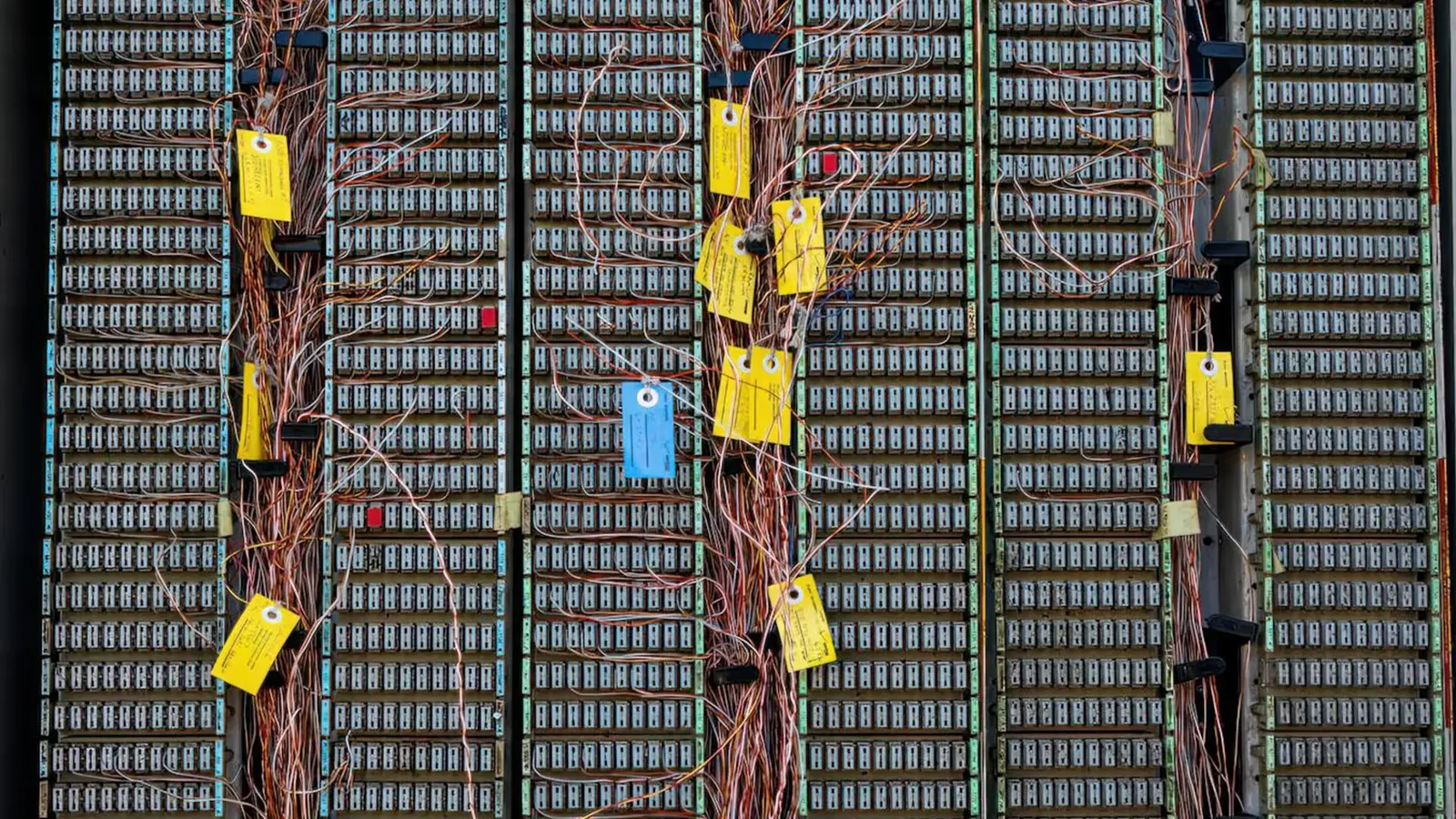 Detailed view of an analog telephone exchange with complex wiring and labels.